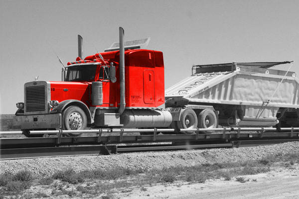 A belly dump truck is prepared to be loaded.